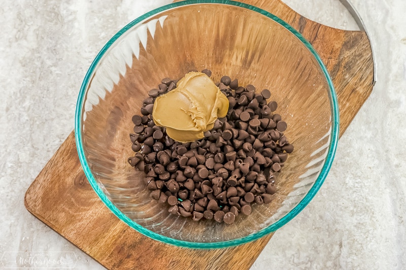 peanut butter and chocolate chips in glass bowl