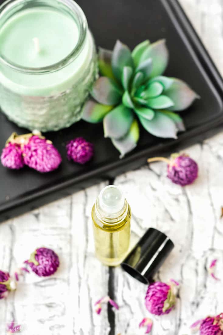 beautiful essential oil roller ball with candle