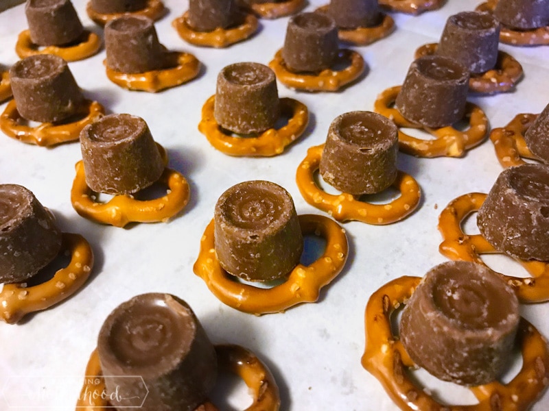 pretzels on baking sheet with Rolo candies