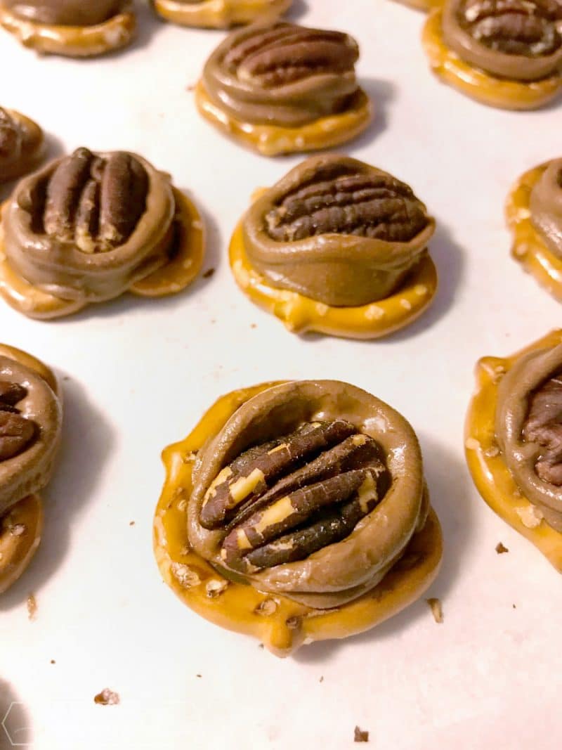 pretzels with melted Rolo candies and pecans