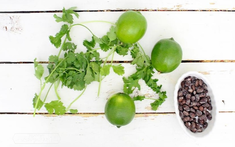 limes, cilantro, and black beans on board