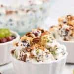 bowls of grape salad with nuts on top