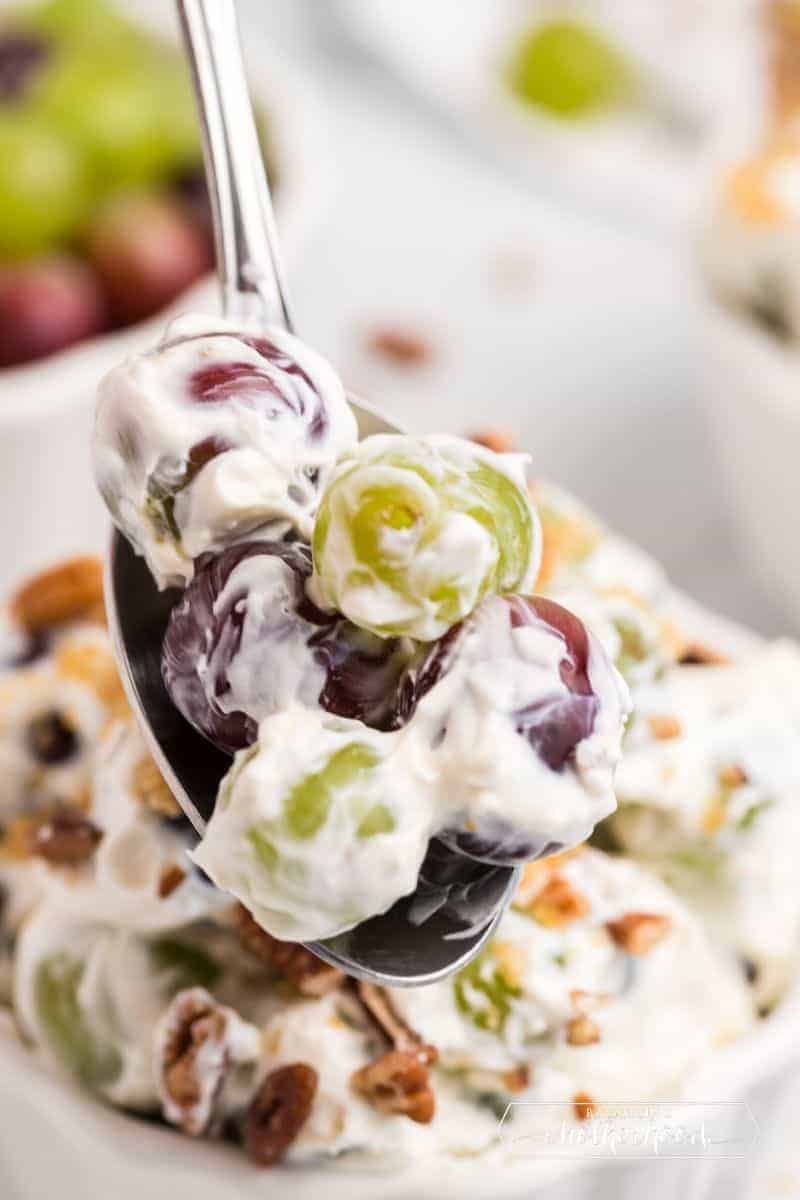 spoon with grape salad on it