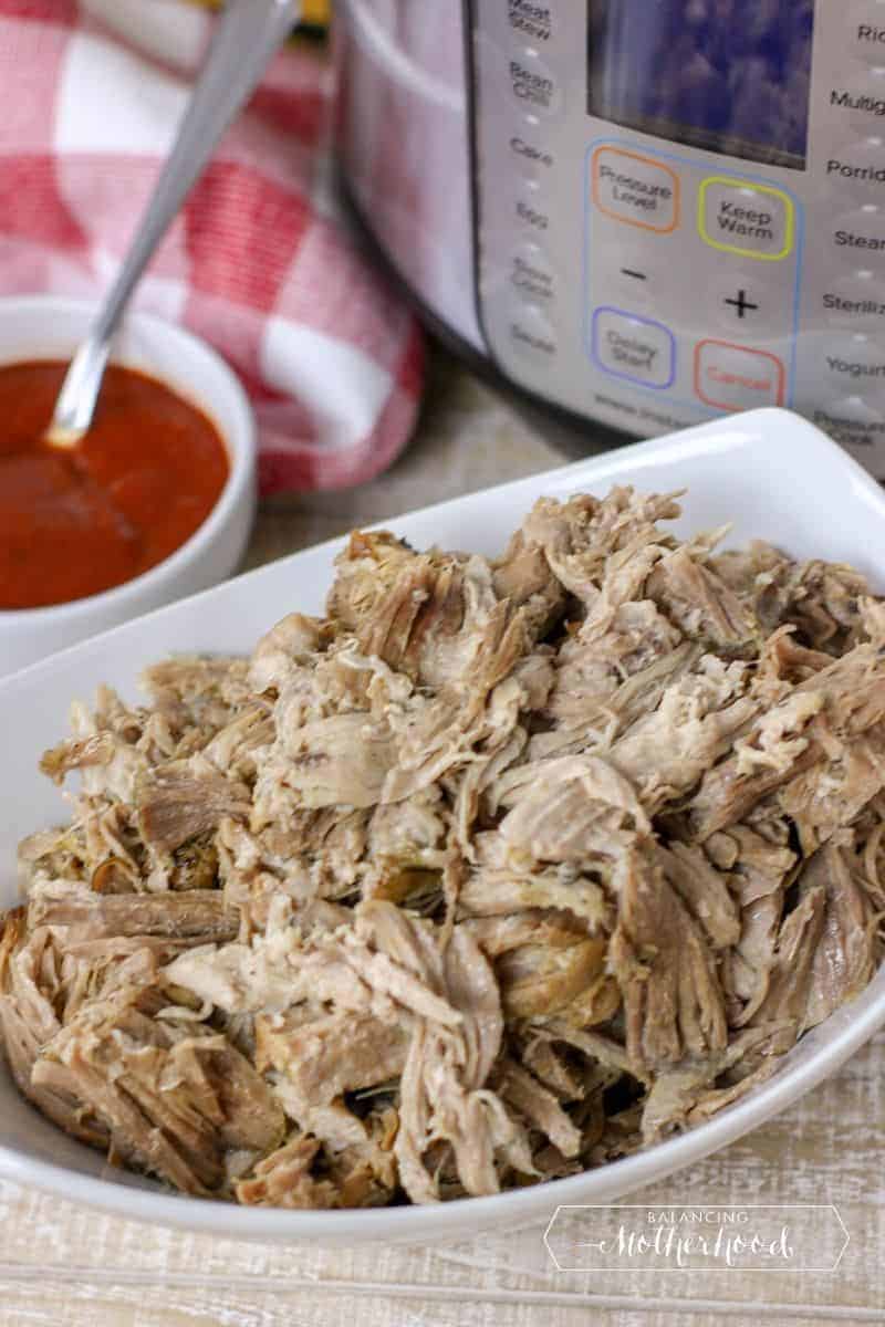 large bowl with shredded, pulled pork by instant pot