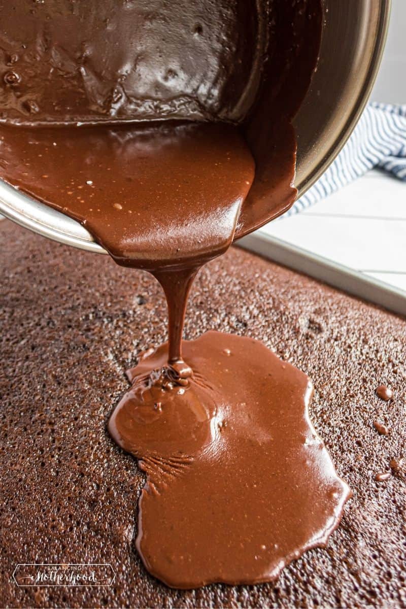 pouring chocolate frosting on sheet cake