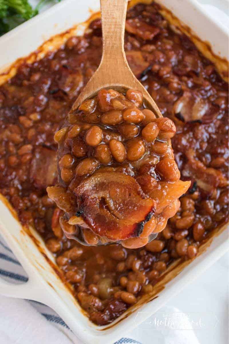 Baked beans on wooden spoon 