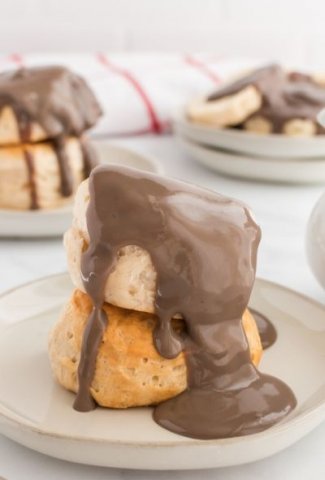 two biscuits with chocolate gravy poured on top