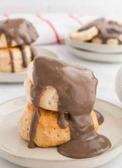 two biscuits with chocolate gravy poured on top