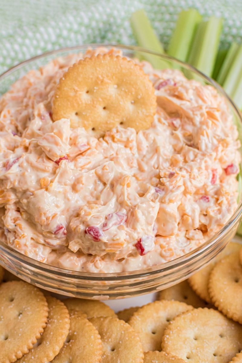 pimento cheese in bowl with Ritz cracker and celery