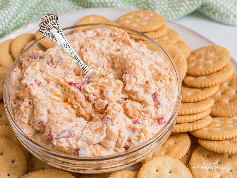 bowl with pimento cheese and butter crackers on the side