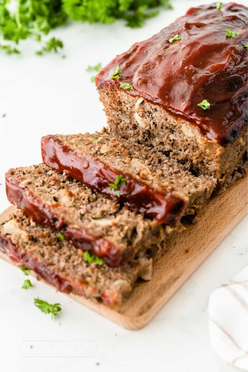 sliced meatloaf with red sauce on top