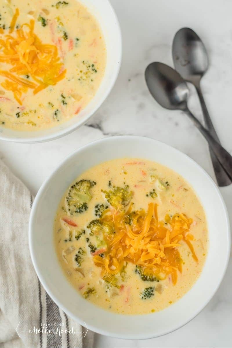 bowl of broccoli soup topped with cheese