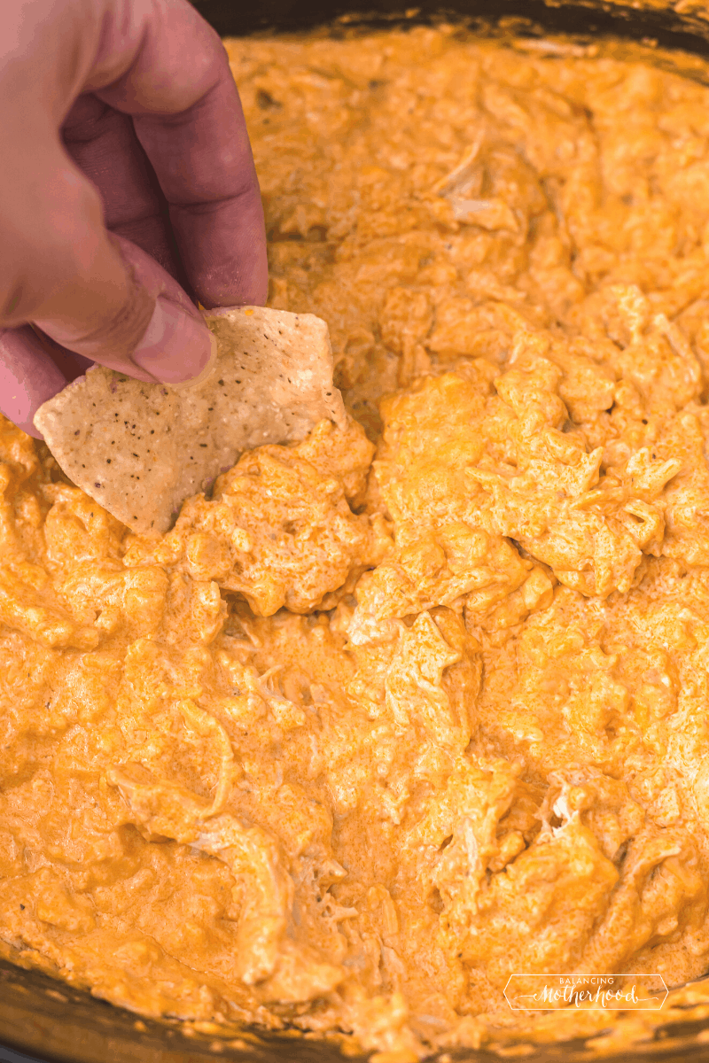 hand with chip in dip