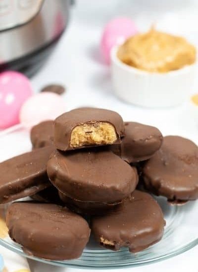 peanut butter eggs stacked on clear plate