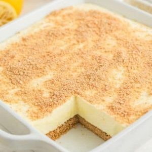 cheesecake in white baking dish with one slice removed