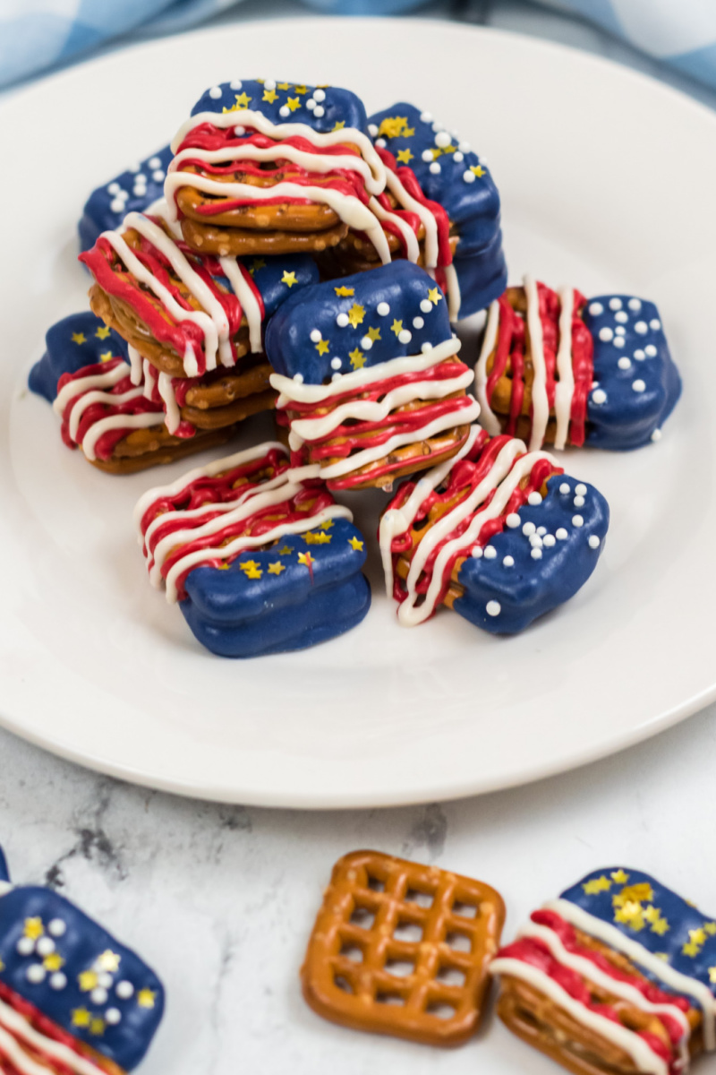 red, white and blue pretzel sandwiches on a white plate