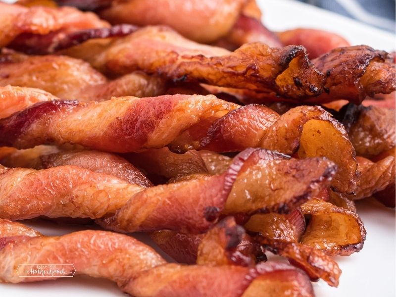 twists of bacon crispy stacked on plate