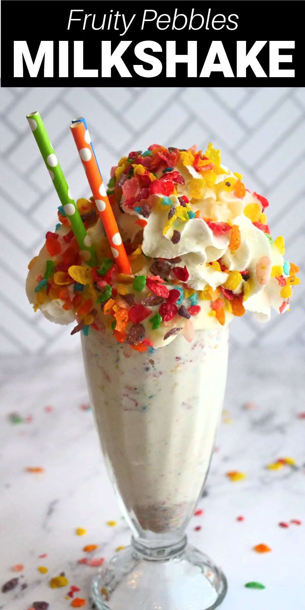 This Fruity Pebbles milkshake is a creamy vanilla ice cream milkshake infused fruity pebbles cereal and drizzled with strawberry syrup then topped with a heaping amount of whipped cream and more Fruity Pebbles as sprinkles. This colorful freak shake is my new favorite milkshake!