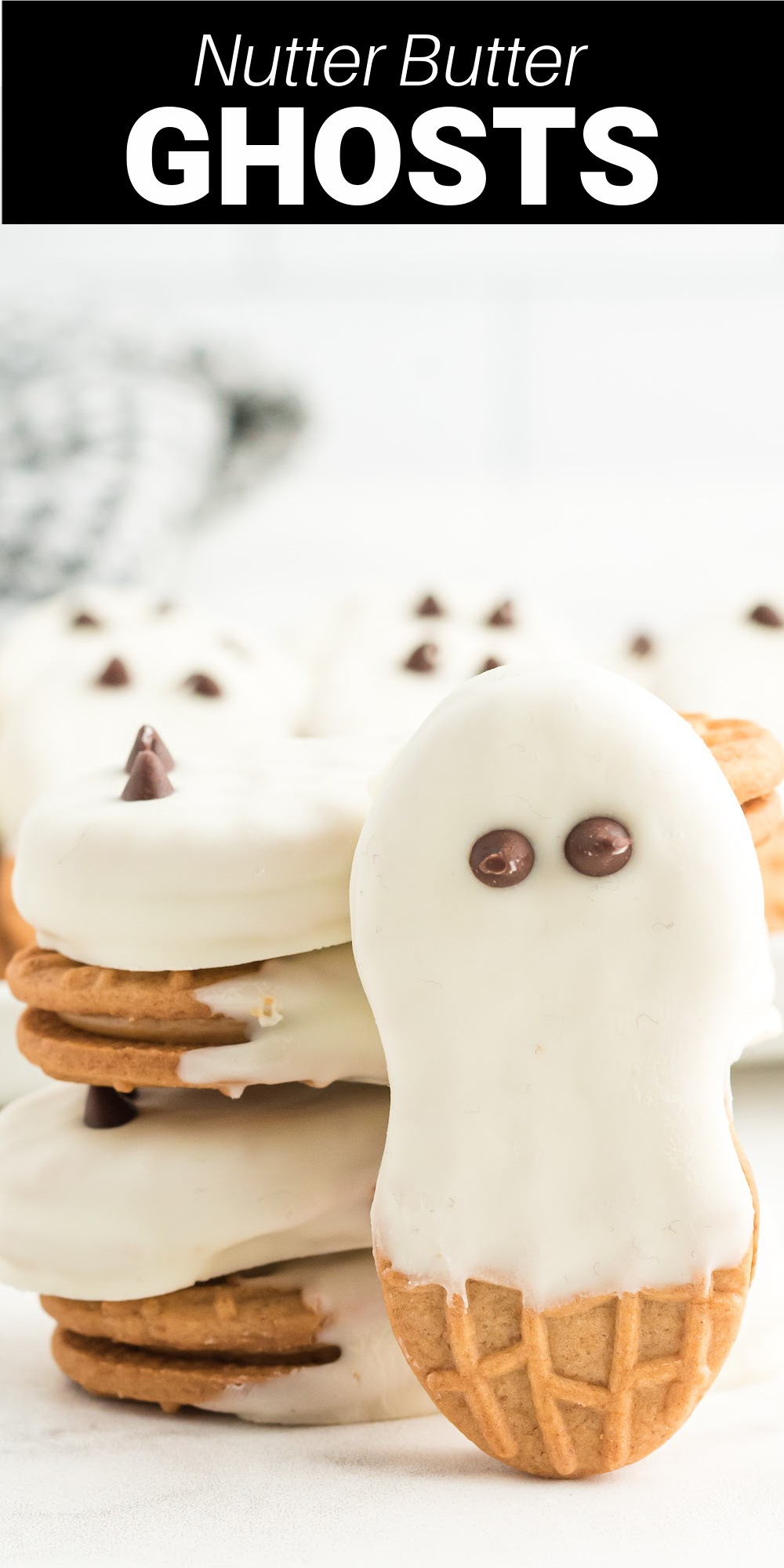 Nutter Butter Ghosts are a simple treat to make with Nutter Butters and chocolate that are perfect for Halloween. 