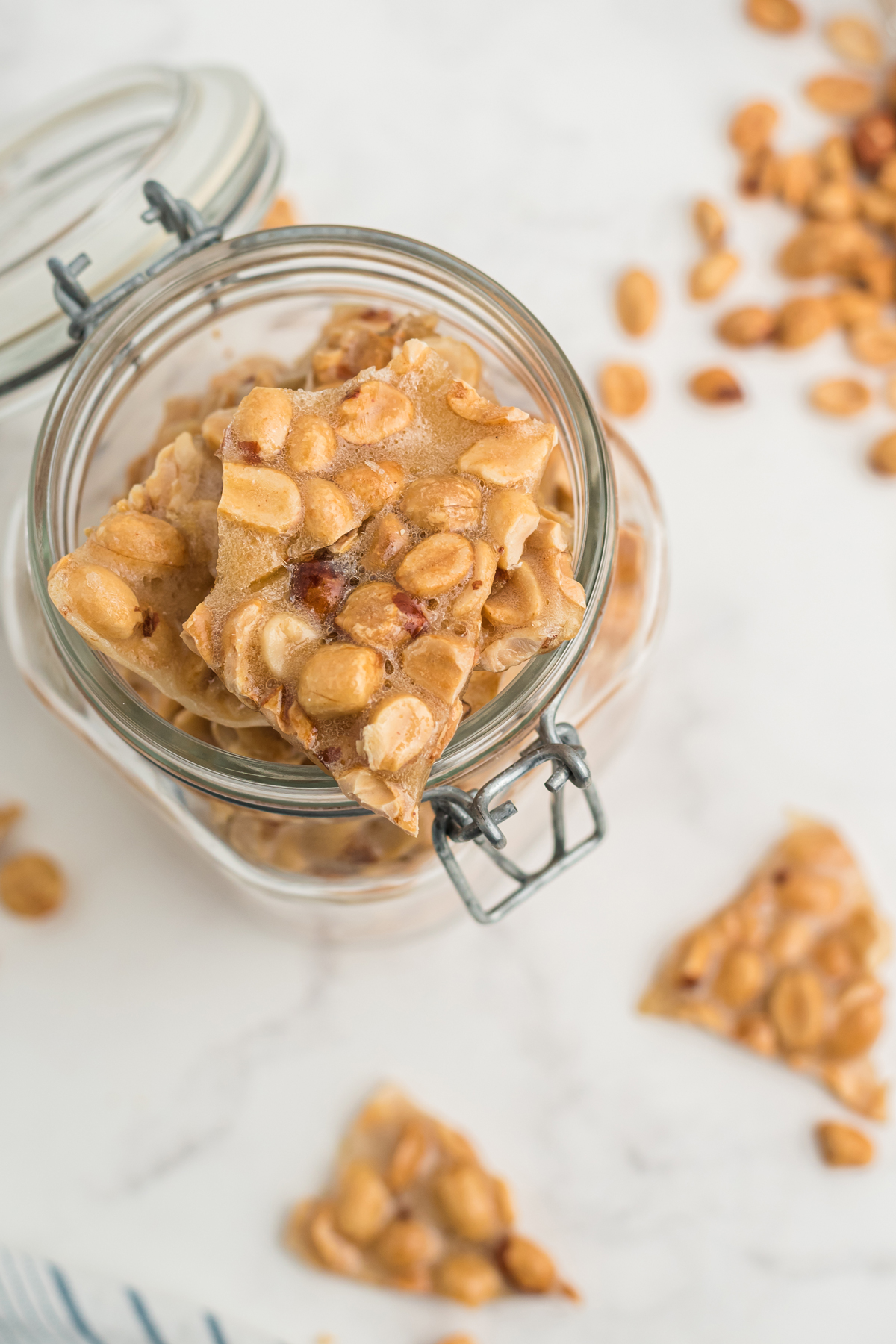Microwave peanut brittle pieces on a jar