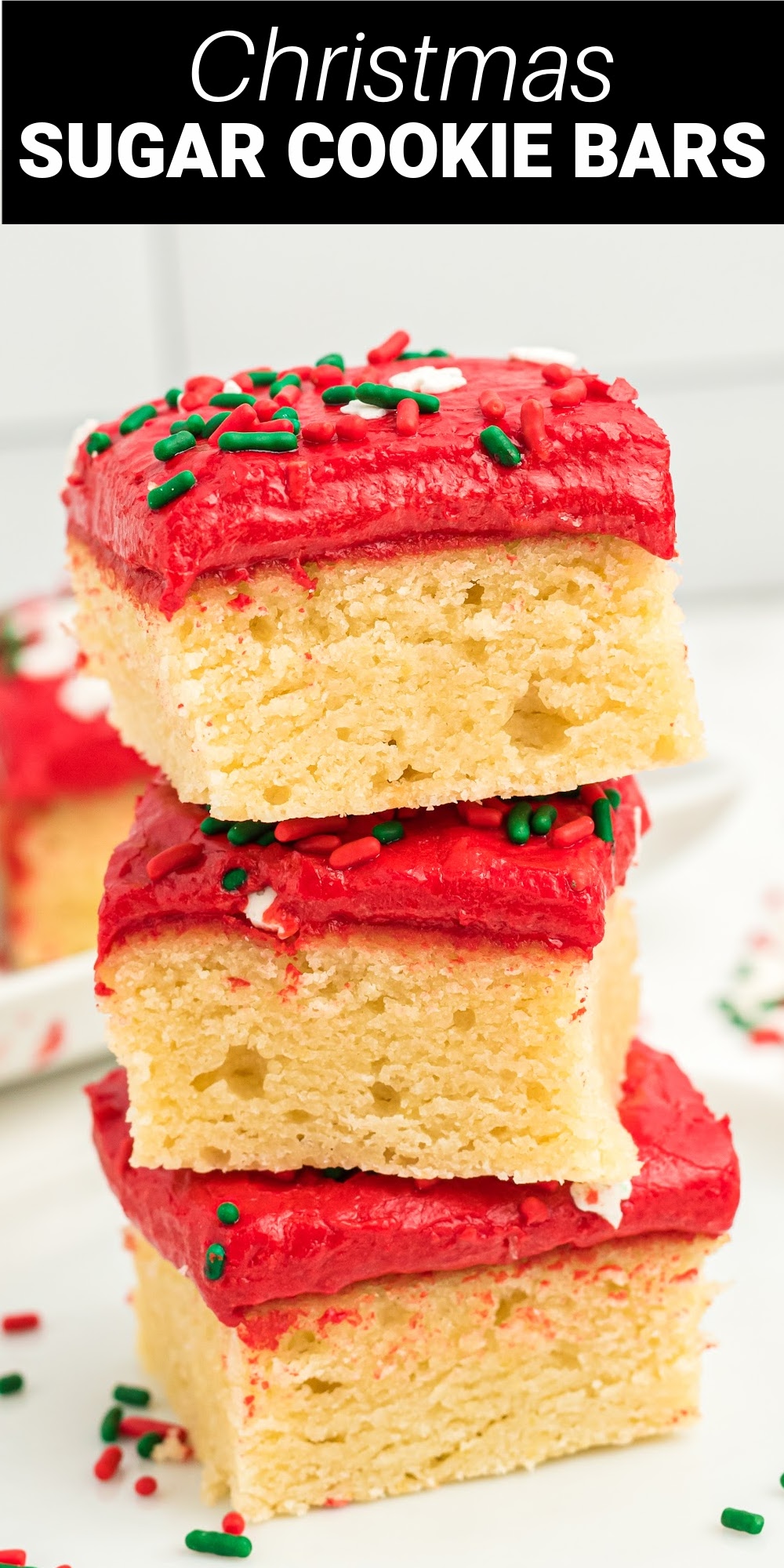 Christmas sugar cookie bars are an easy way to make colorful Christmas sugar cookies with all the work. These buttery sugar cookie bars are thick and delicious topped with a sweet buttercream frosting and Christmas sprinkles.