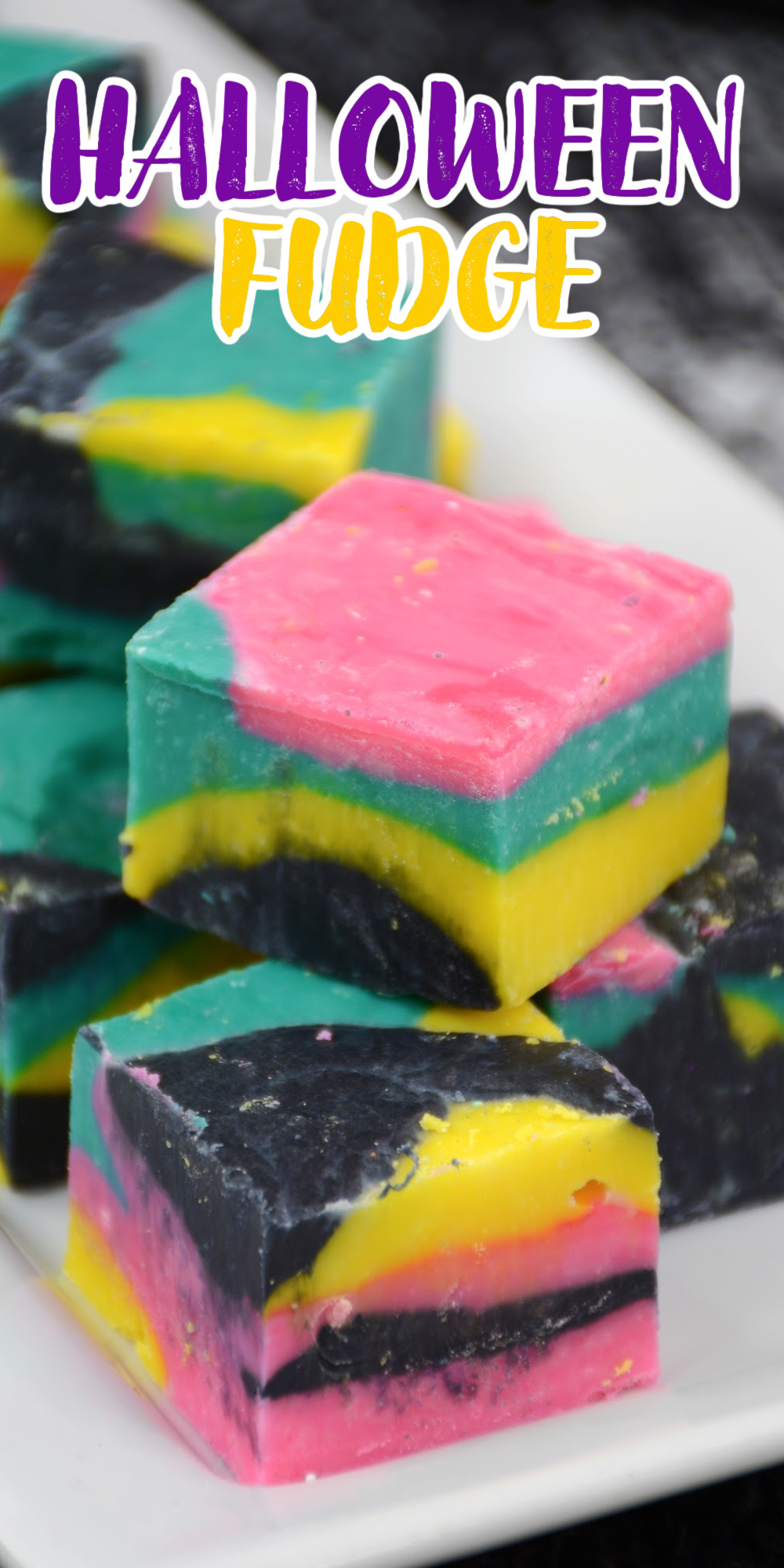 Halloween Fudge doesn't have to be just black and orange. We've made a fun colorful version with pink, teal, and yellow of this vanilla chocolate fudge recipe.