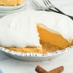 slice removed from pie showing pumpkin layer inside