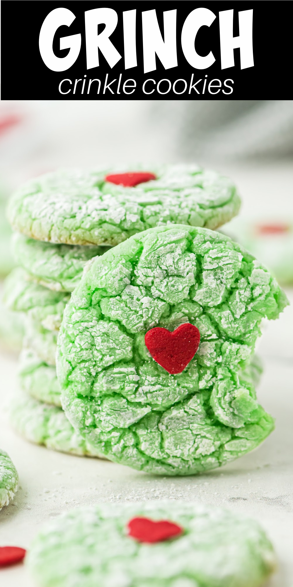 Grinch crinkle cookies are an easy cake mix cookie that's soft and delicious! These fun treats have a huge red sprinkle in the center of the soft cookie that kids and adults love.