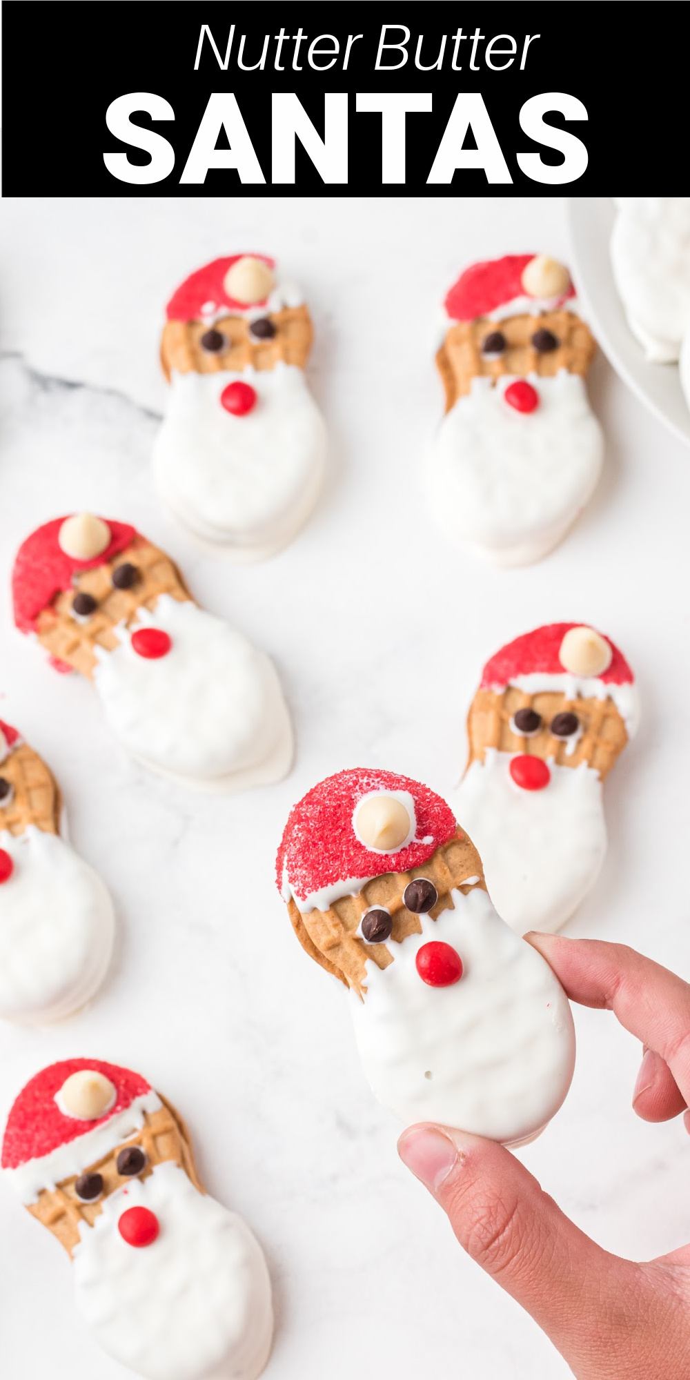 Santa Nutter Butter Cookies are the perfect addition to your Christmas cookie exchange. Peanut nut nutter butter cookies are dipped in chocolate and made to look like Santa! It's a cute treat the kids love!