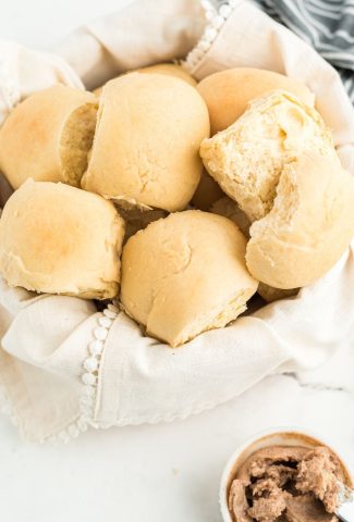 rolls in basket with cinnamon butter