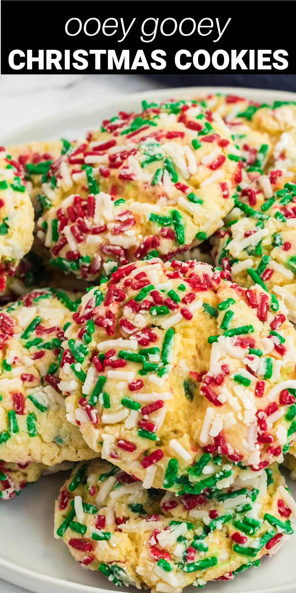 These rich and decadent Ooey Gooey Butter Christmas Cookies are so deliciously soft they will literally melt in your mouth. They're perfect little confections that are easy to make and are guaranteed to be a crowd pleaser!