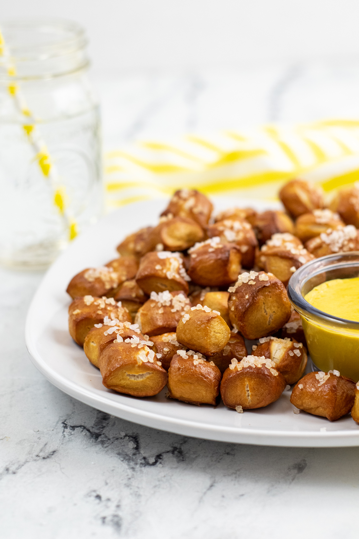 cooked pretzel bites stacked on plate