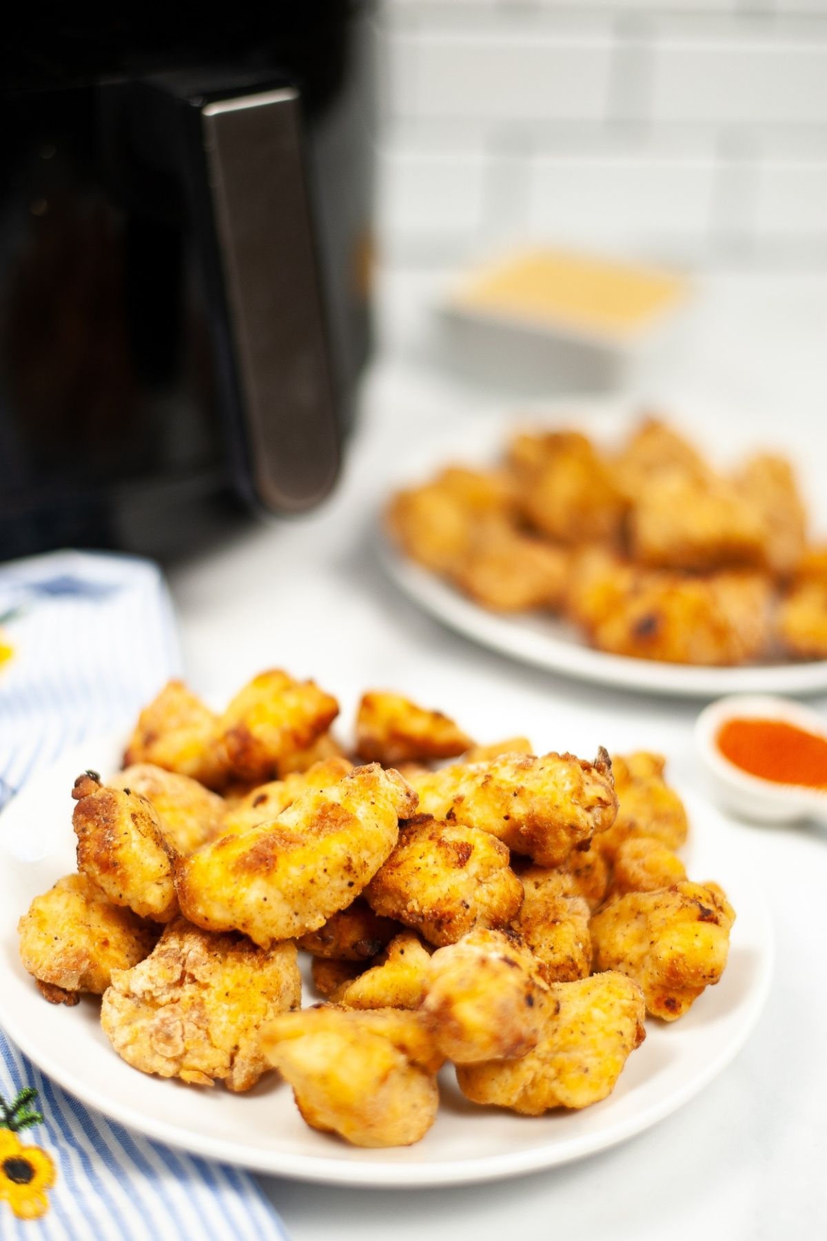 chicken nuggets in front of air fryer