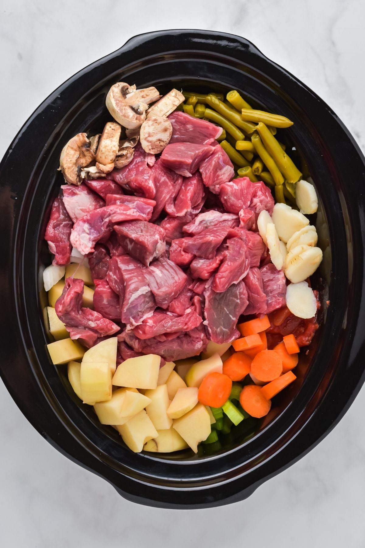 hing says comfort food on a cold night like a hot bowl of this homemade Crockpot Beef Stew. Tender chunks of beef, veggies, and potatoes cook together in a delicious tomato and beef broth. 