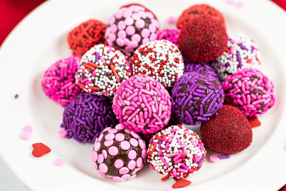pink, purple, and red/white sprinkle balls of brownie truffles