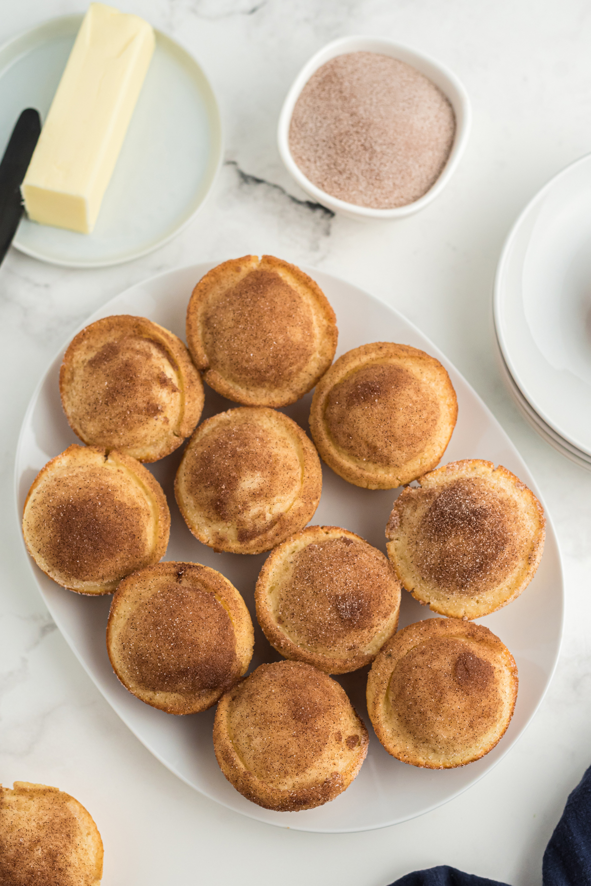 Cinnamon sugar muffins on a white plate