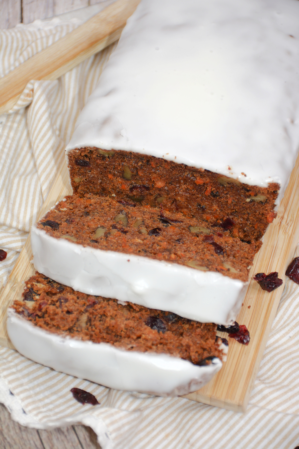 Carrot cake bread loaf with icing cut in slices