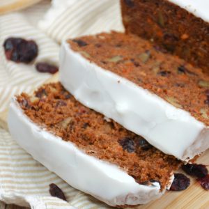 Carrot cake bread loaf with icing cut into slices