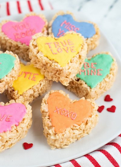 Valentine's day conversation heart rice krispie treats on a plate.
