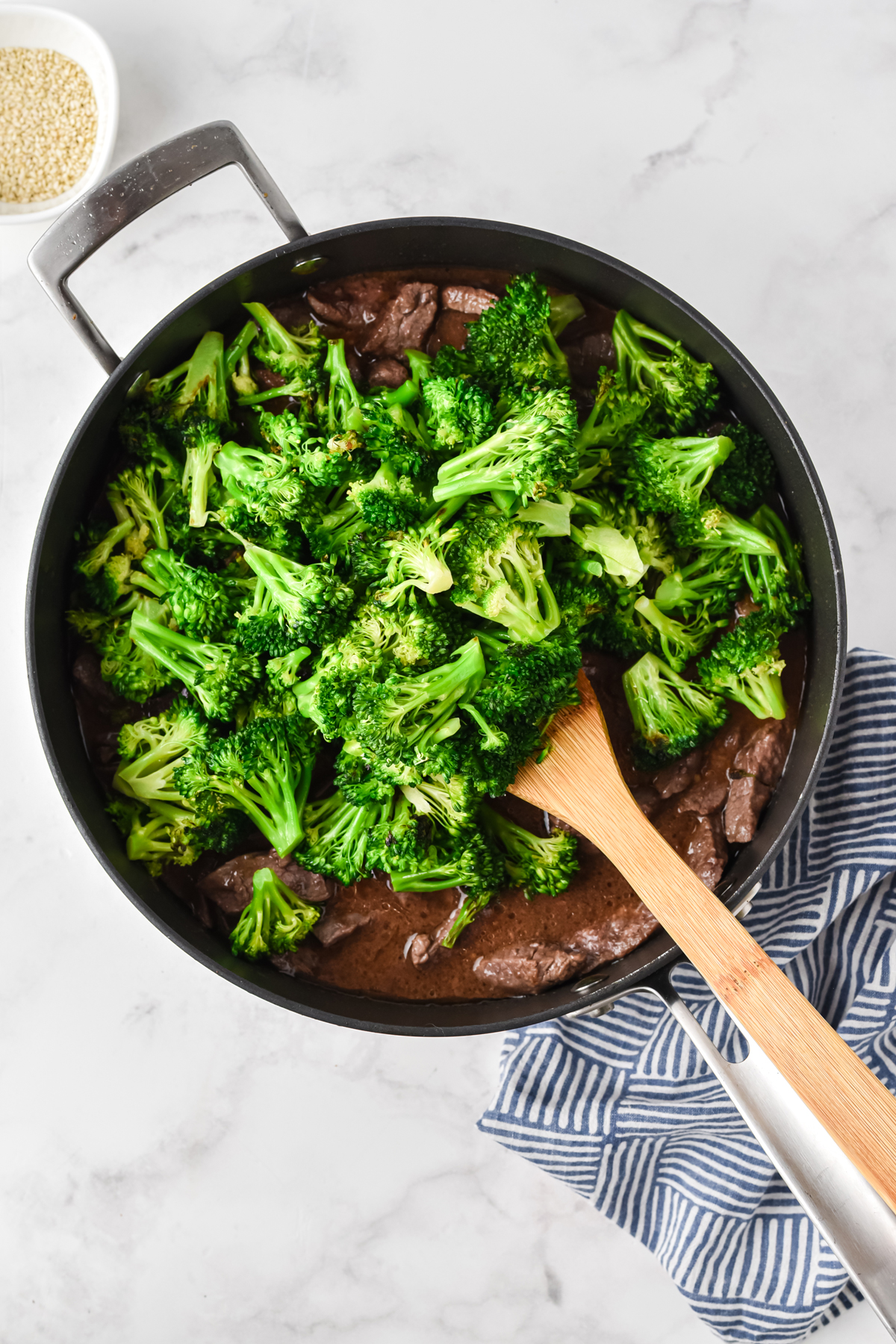 Mixing brocolli with meat