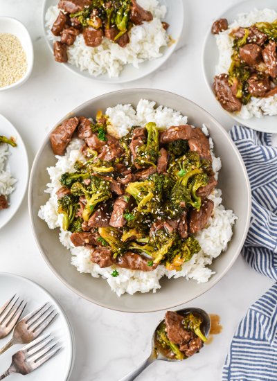Beef and broccoli stir fry served with rice.