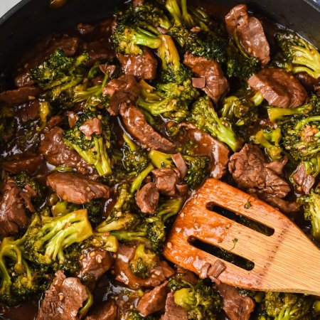 beef and broccoli in cast iron skillet