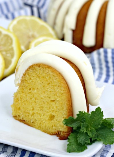 lemon bundt cake slice with white frosting on a plate