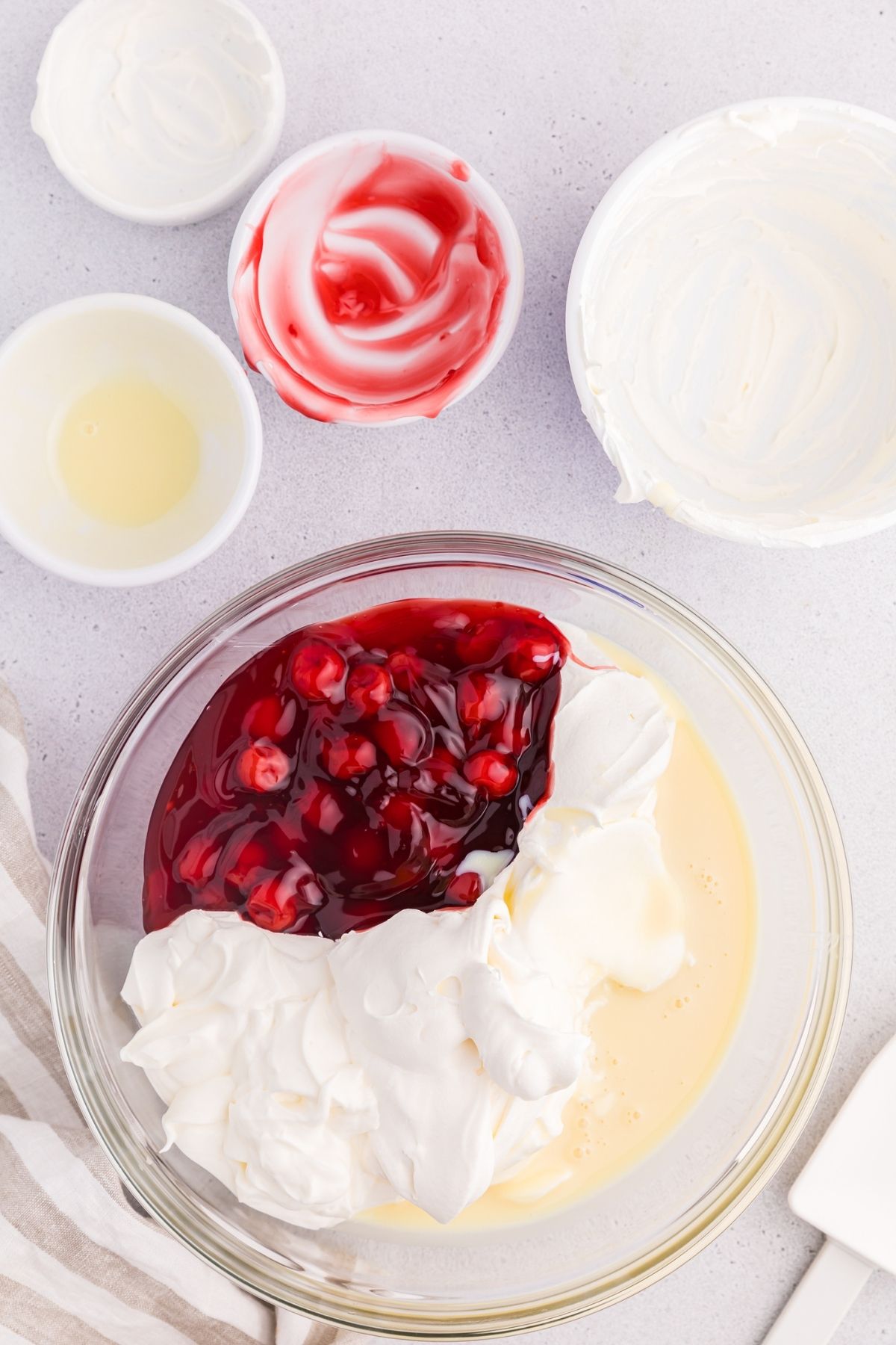 cherry pie filling, Cool Whip, and condensed milk in mixing bowl