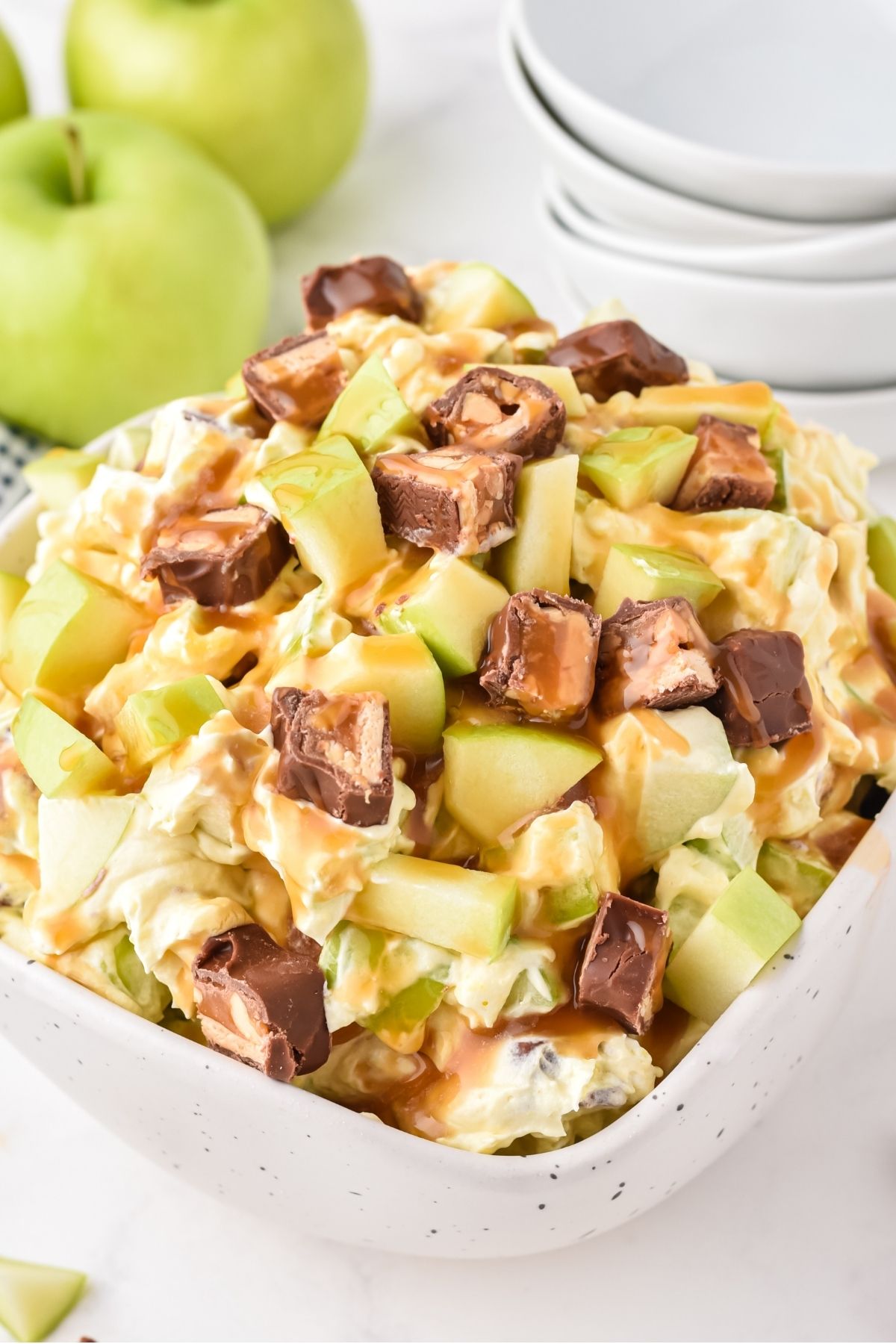 chopped Snicker's with chopped green gala apples in a creamy sauce with caramel on top. 