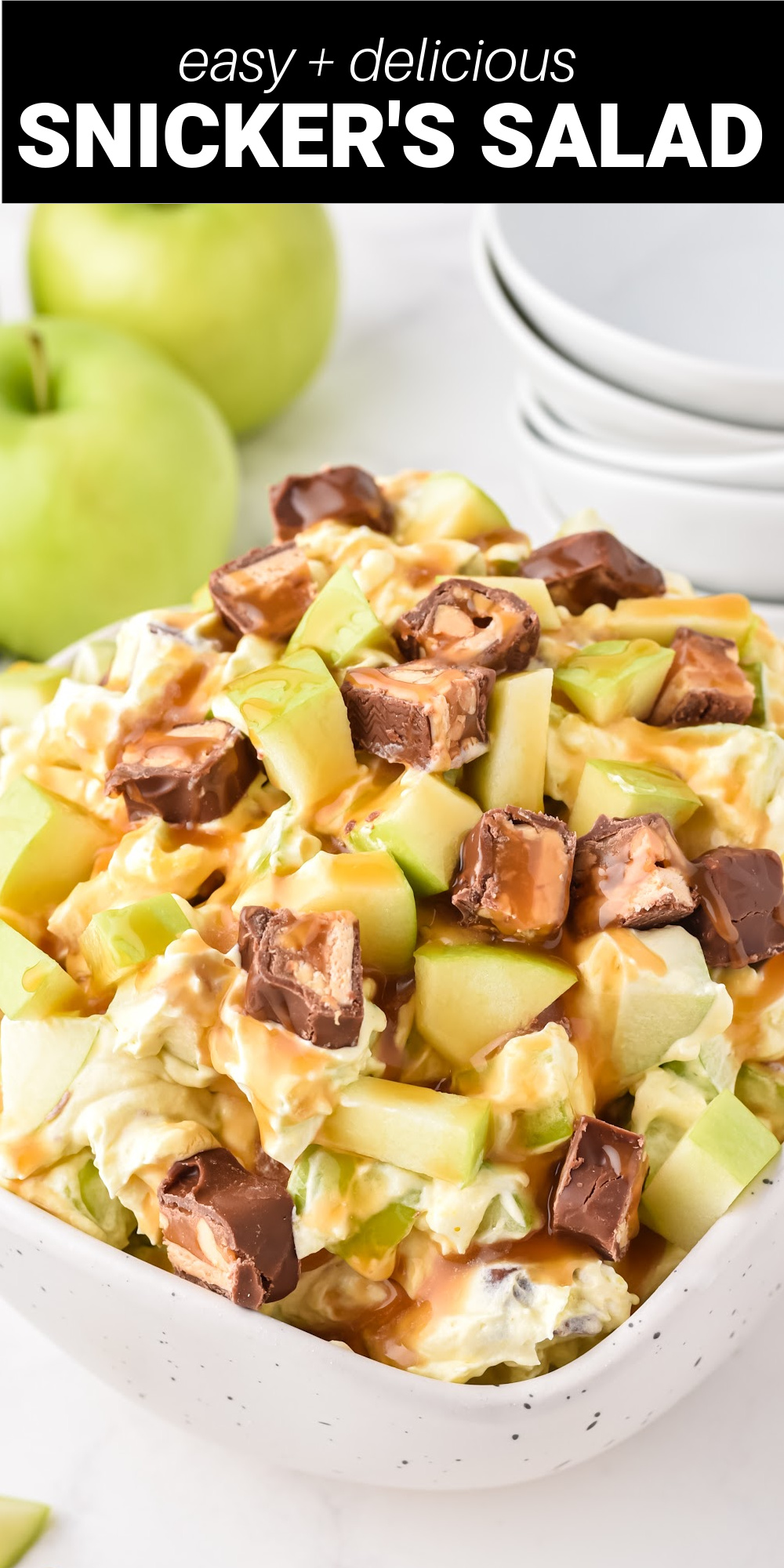 This delicious Snickers Salad is a sweet and tart dessert salad that will be a huge hit at your next potluck or family gathering. Tart green apples and sweet Snicker bars are mixed into a creamy pudding and whipped topping base to create a fluffy and decadent dessert that'll have all the kids begging for seconds (and the adults too)!