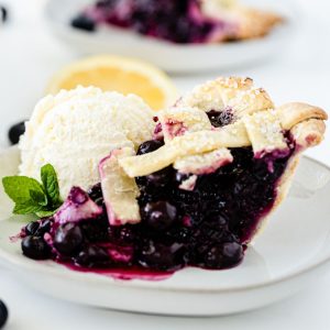 slice of blueberry pie with vanilla ice cream