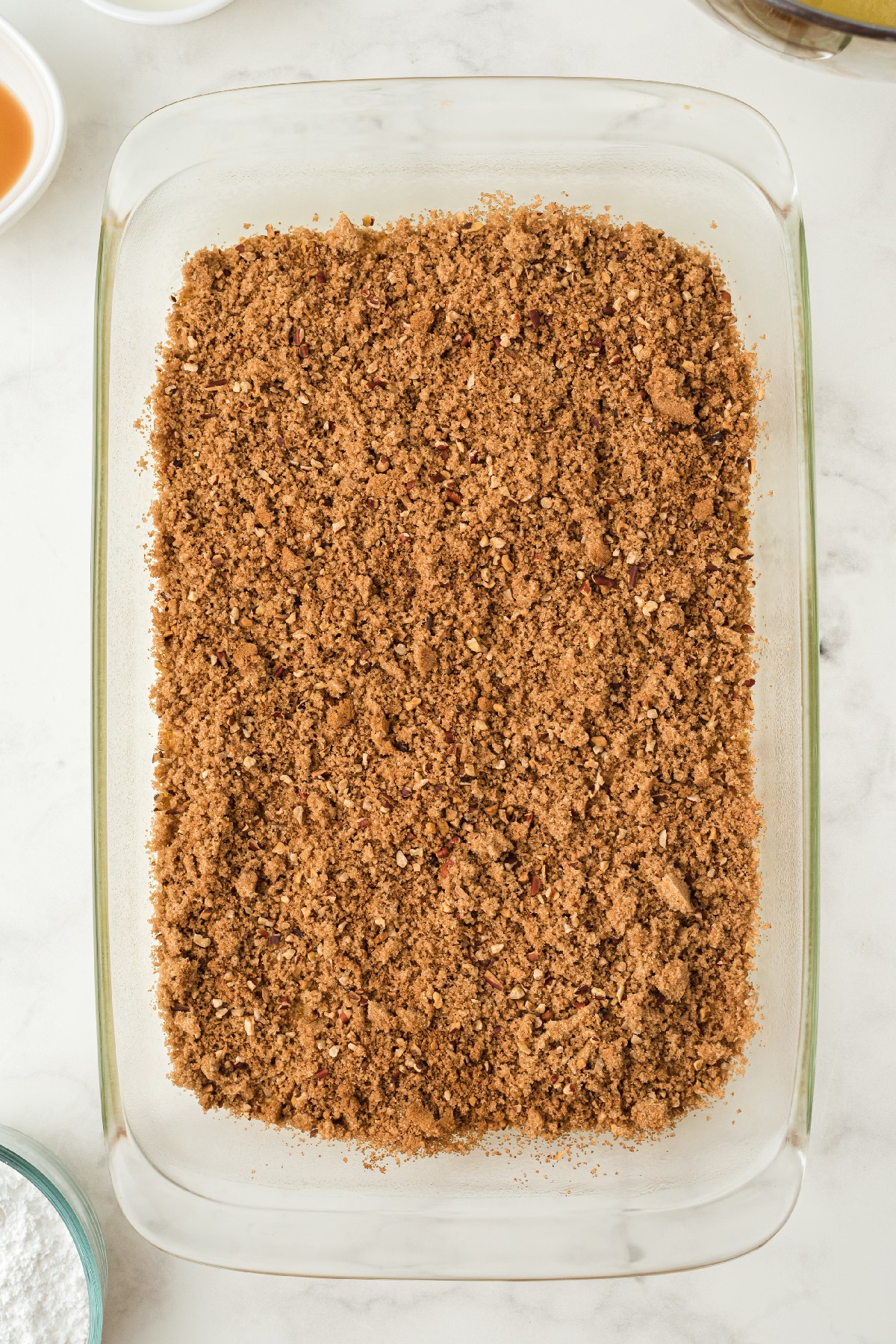 Honey Bun Cake mixture with pecans on a tray