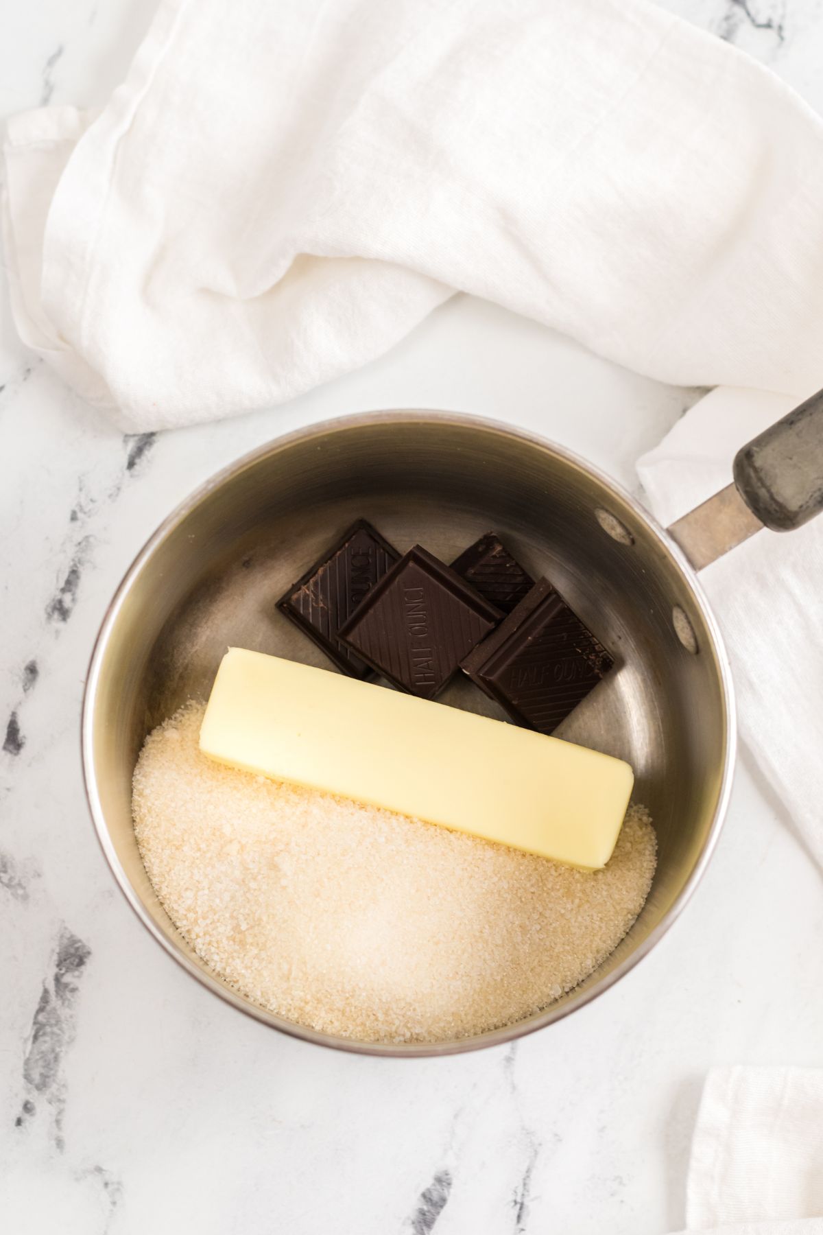 butter chocolate and sugar in pan