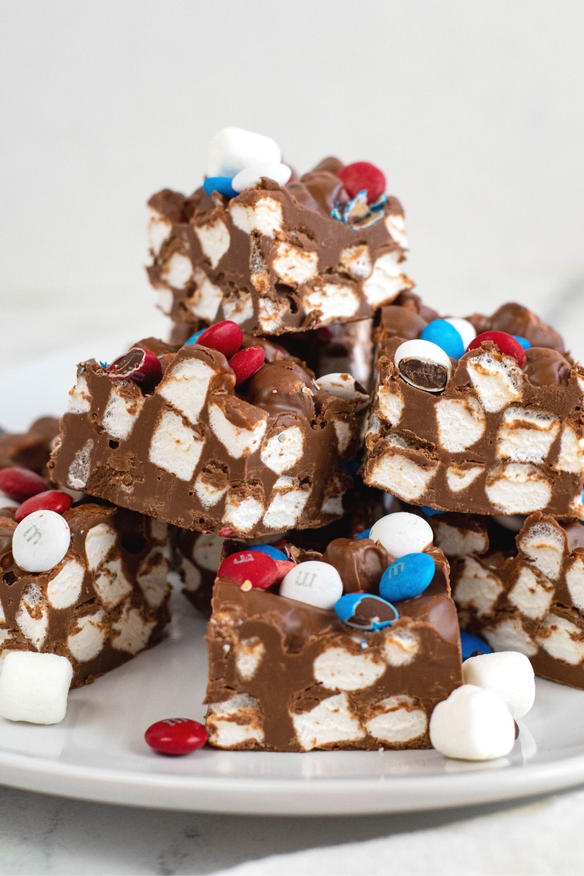 stacked chocolate marshmallow bars with red, white, and blue M&Ms